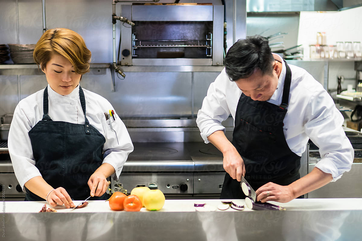 A Male And Female Chef Prep Together