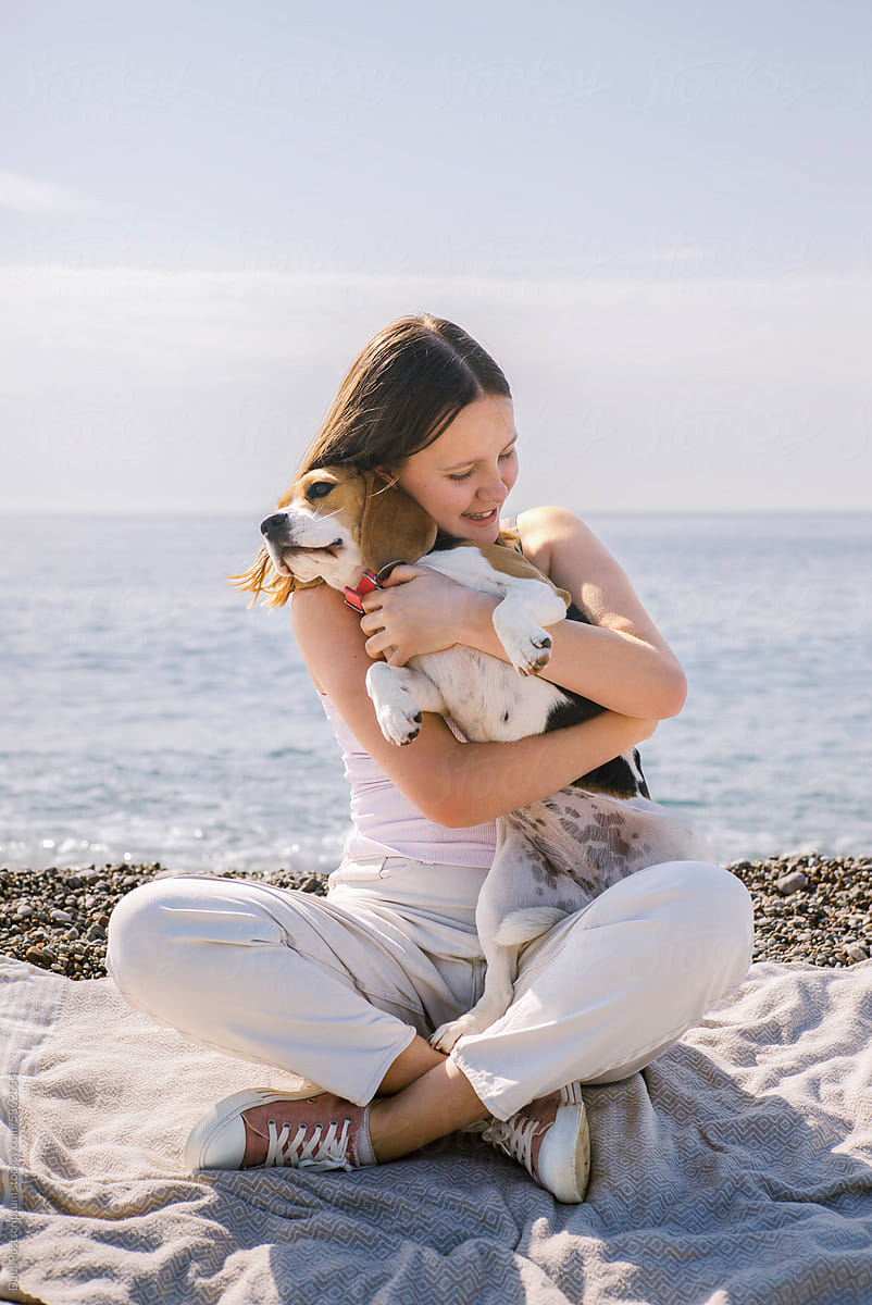 Happy young woman with her dog.