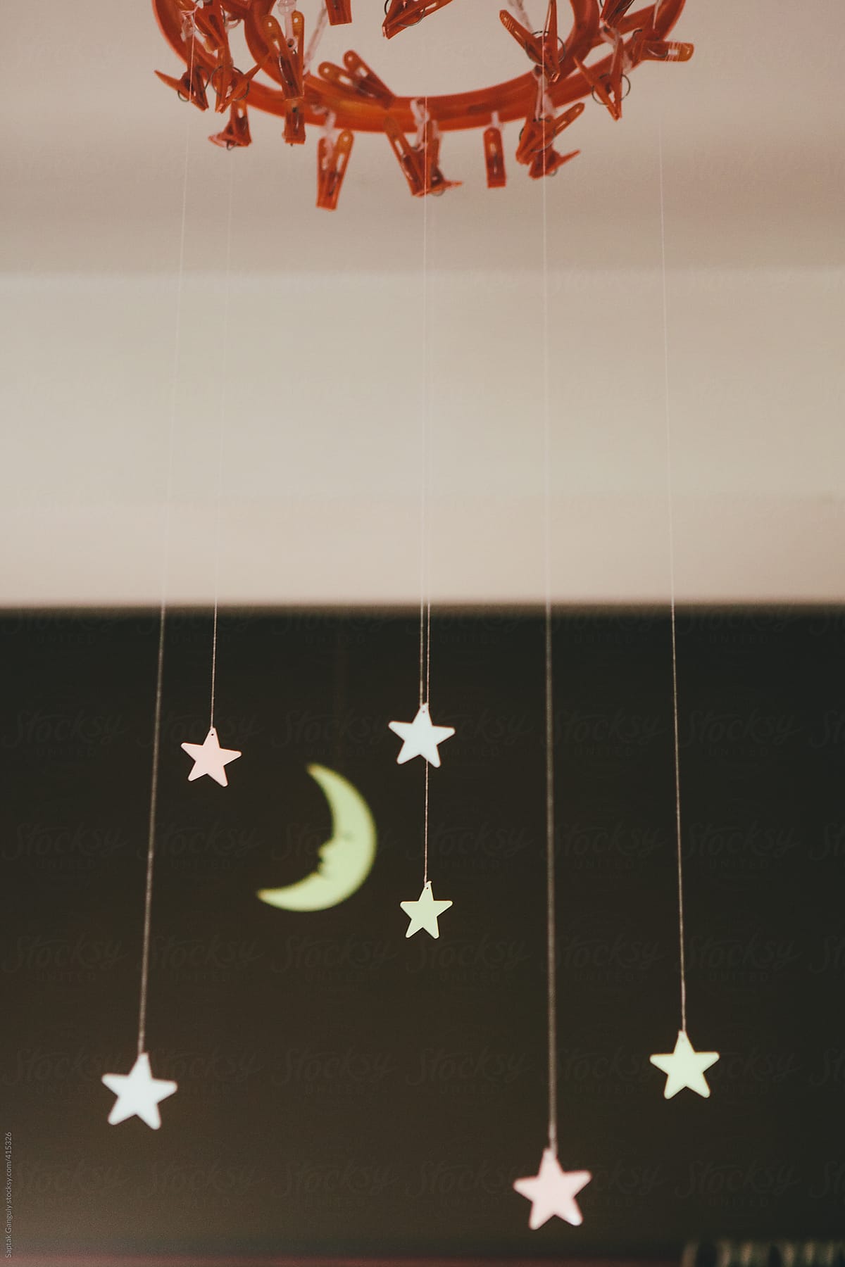 Glow Stars Hanging From Ceiling By Saptak Ganguly Stocksy