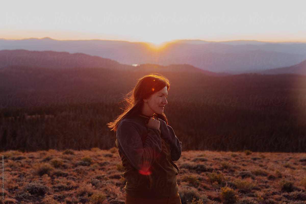 Outdoorsy woman at sunset