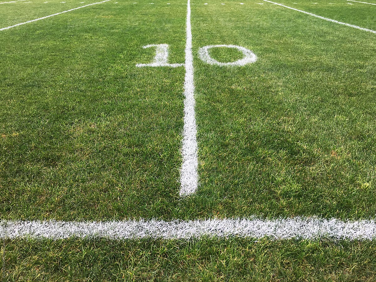 A Ten Yard Line Painted On A Grass Football Field