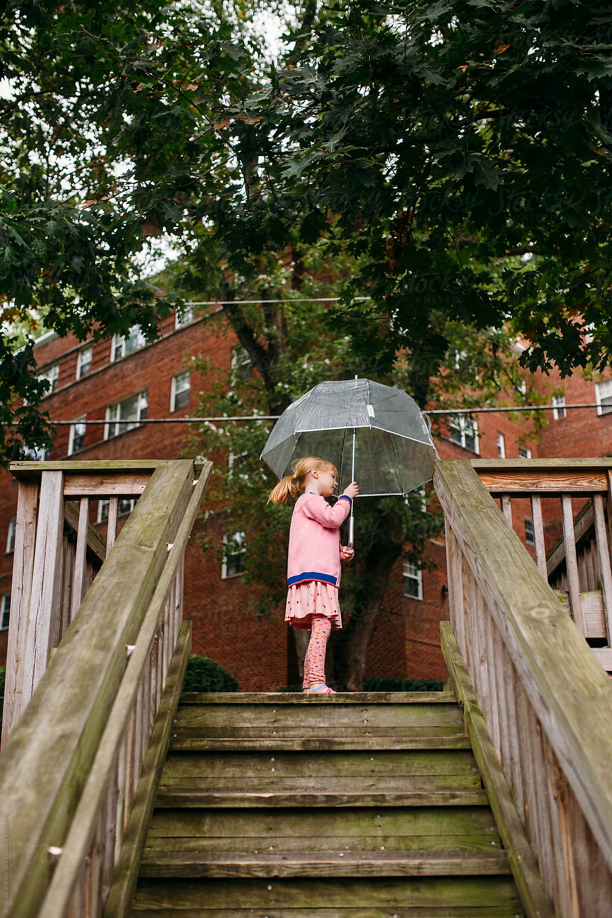 Girl With Umbrella on Stairs