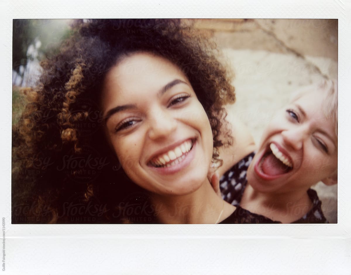 Two Girlfriends Laughing And Looking At Camera By Guille Faingold
