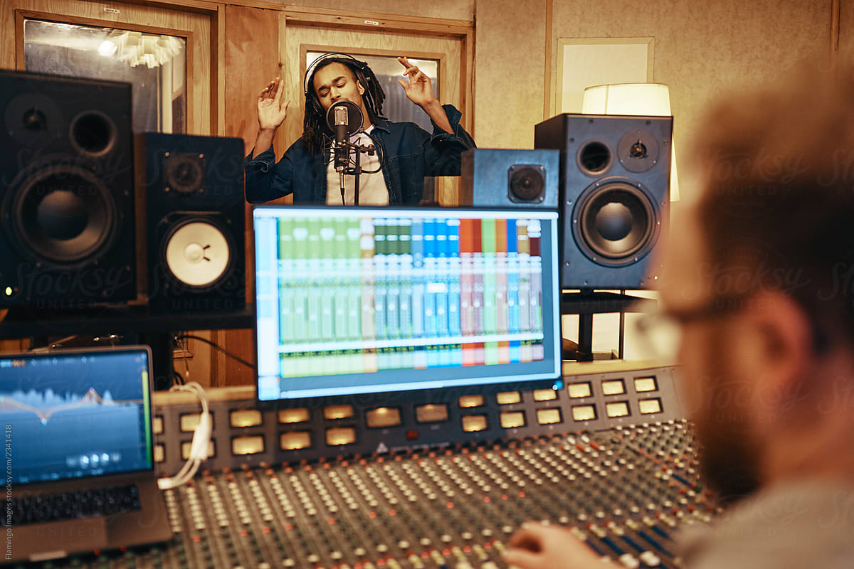 Musician and producer in music studio.