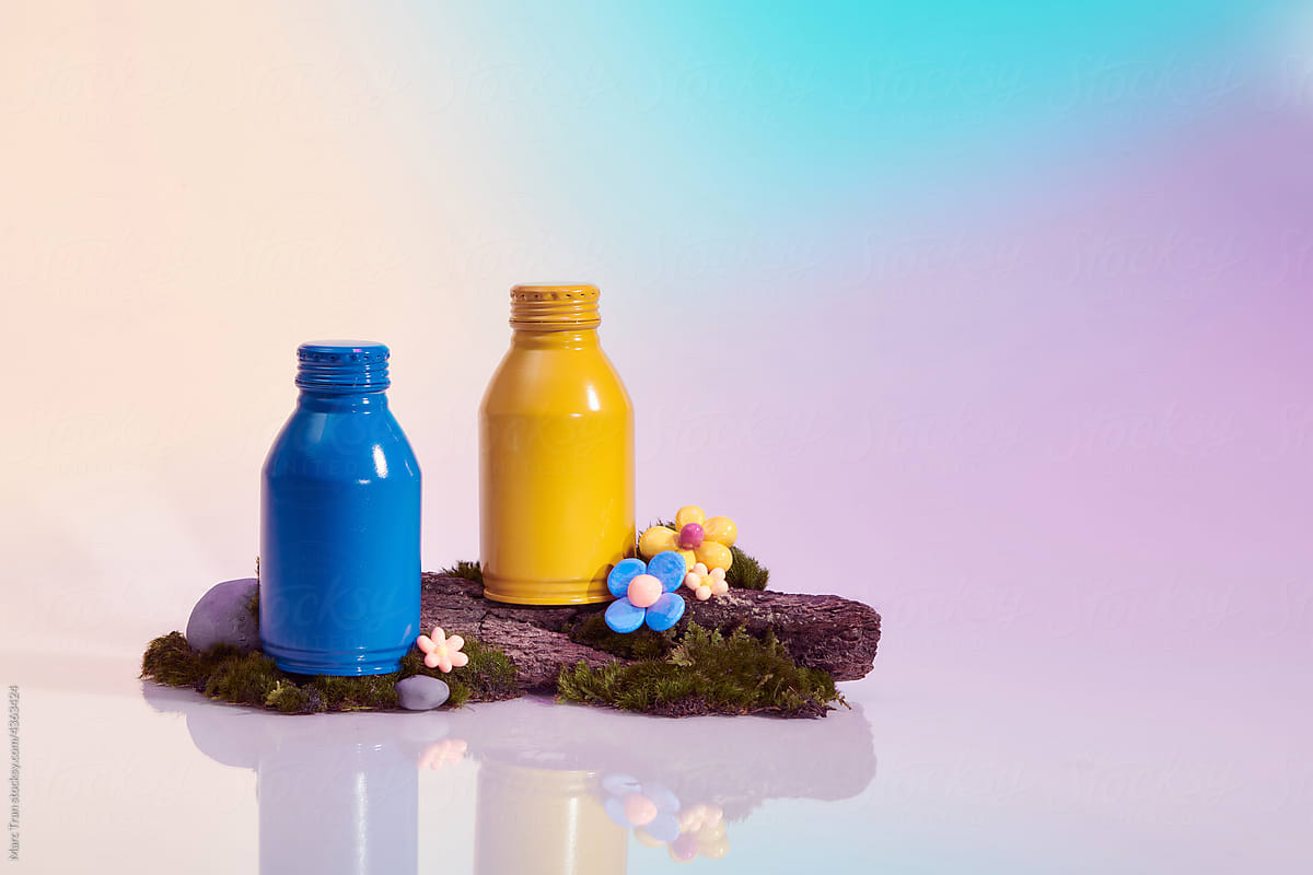 Blue and yellow soda bottle in colorful background,