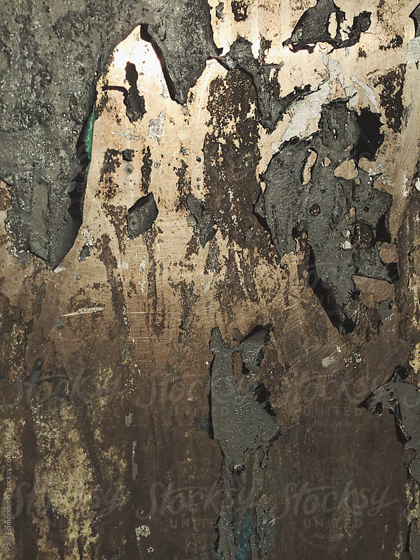 Close up of peeling paint and poster on wall