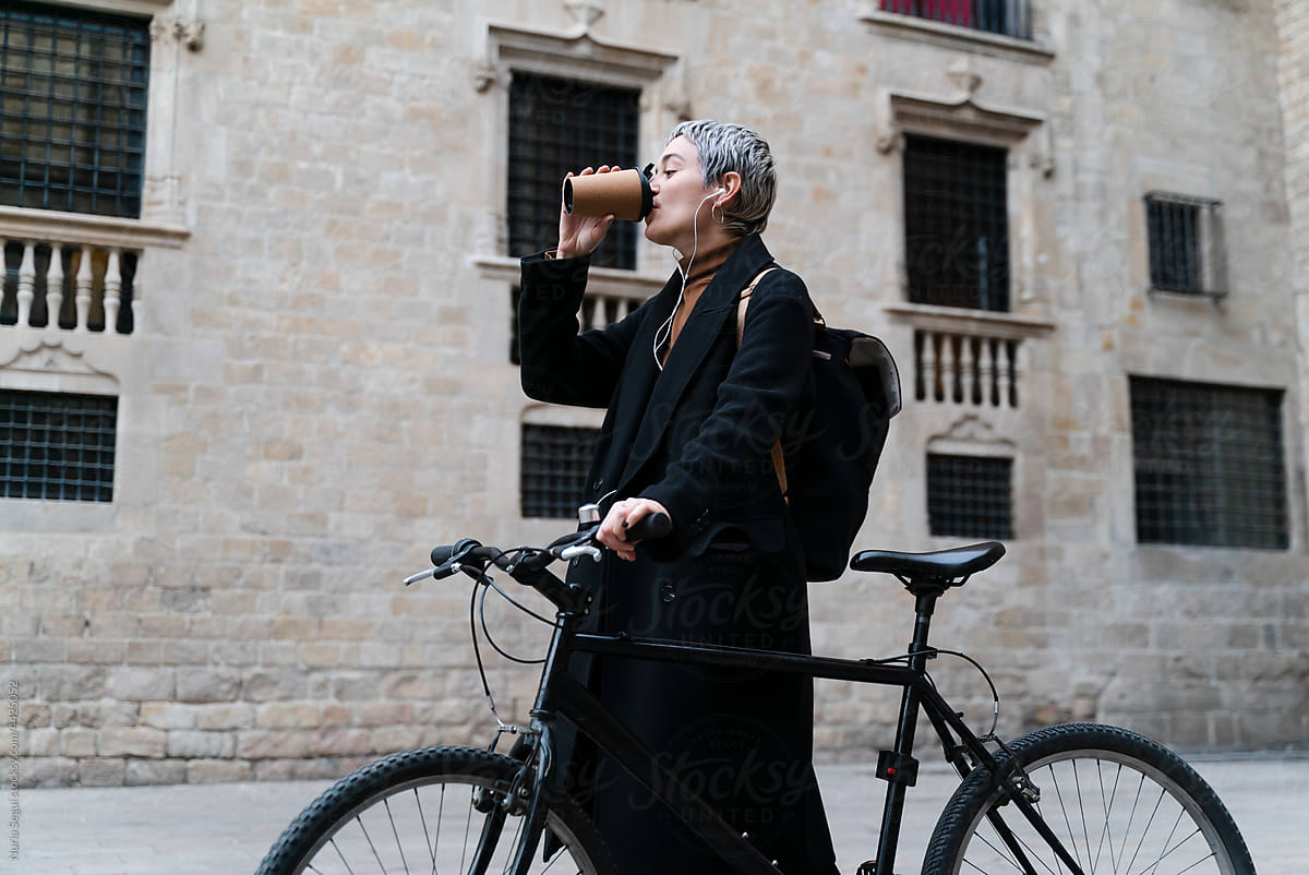 Female Bicyclist Using Headphones