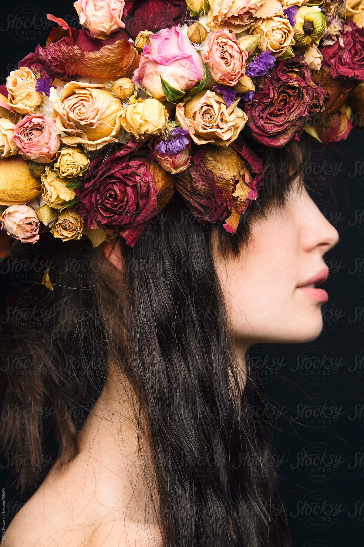 Close-up of young woman wearing dried flower wreath