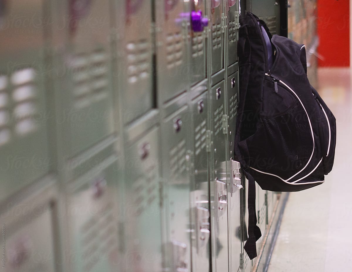 Backpack hangs on outside of open locker