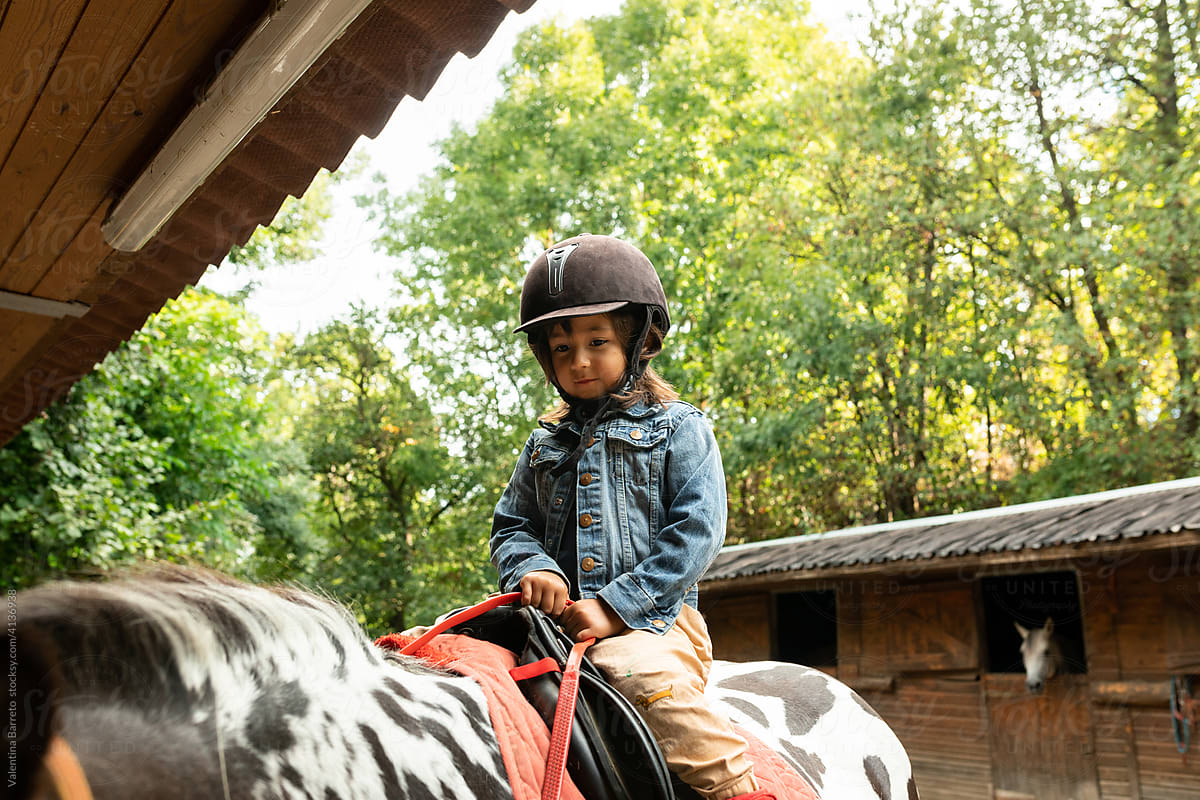 Kid riding horseback