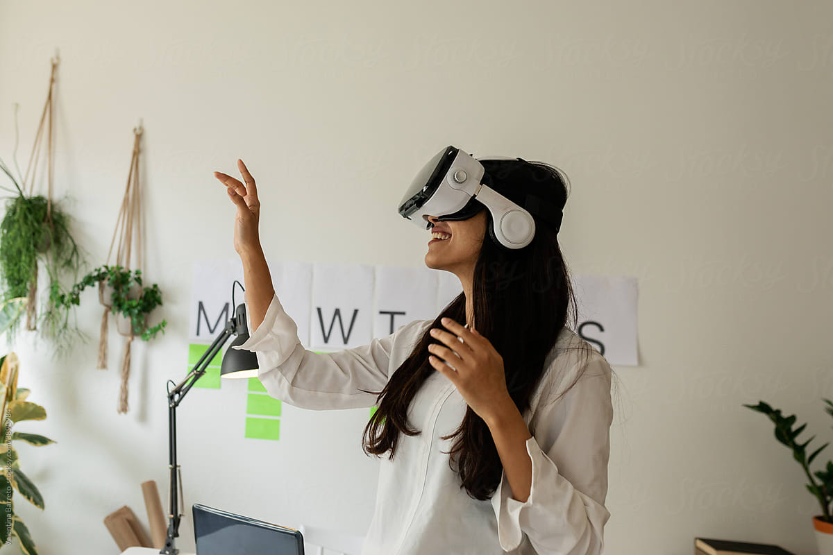 Close-up of woman with glasses of virtual reality at office