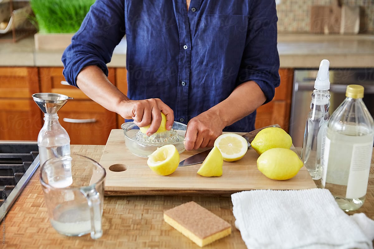 Mature woman making her own natural cleaning products at home