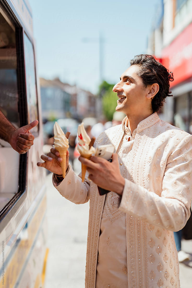 A happy man buying ice cream at the ice cream van