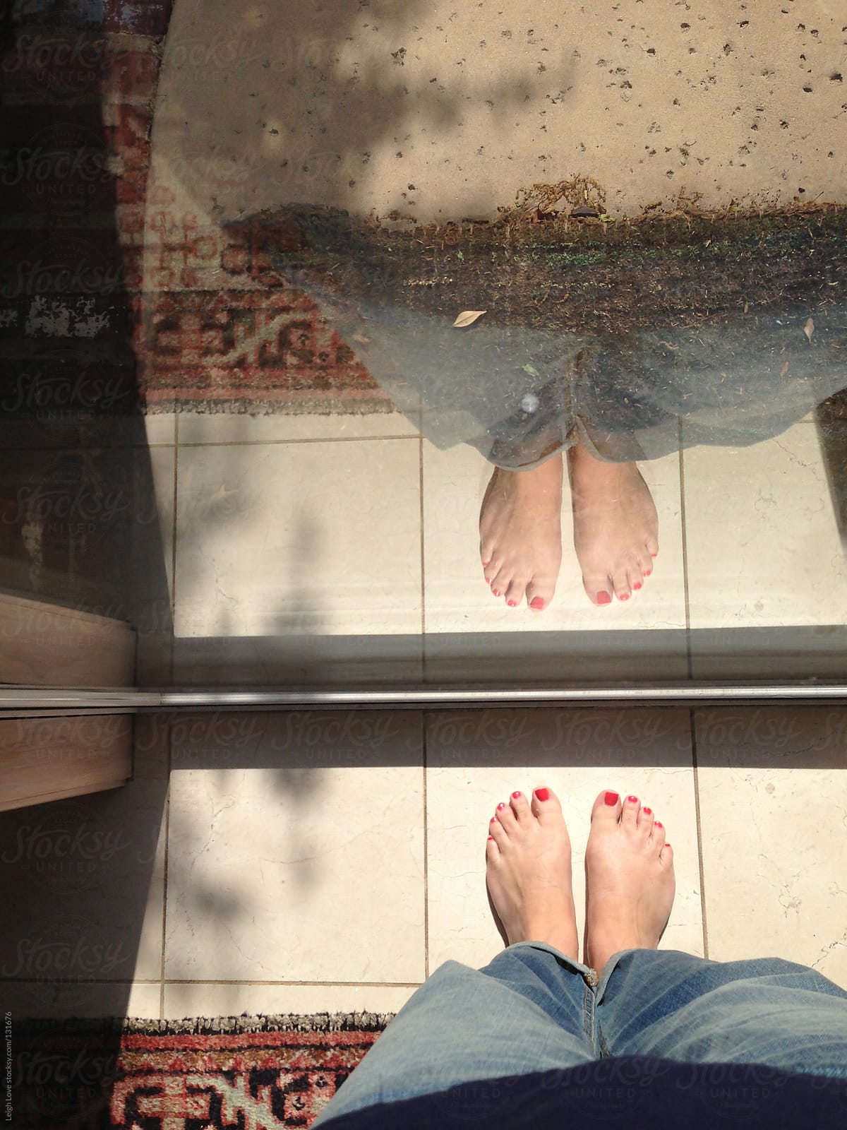 Reflection of legs and Feet in Window