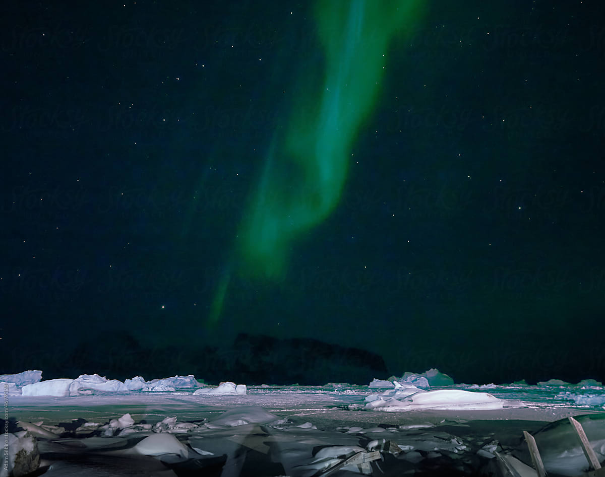 Greenland Arctic aurora northern lights over sea ice, icebergs