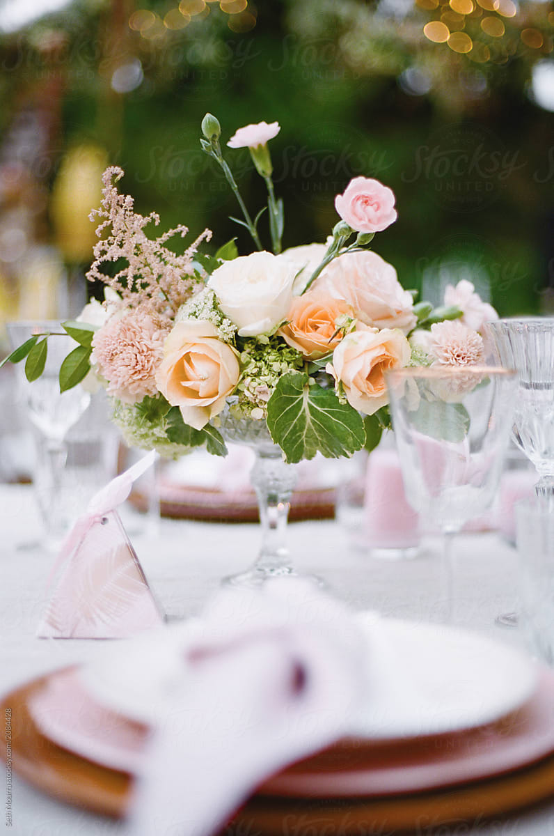 Elegant Outdoor wedding tabletop with florals
