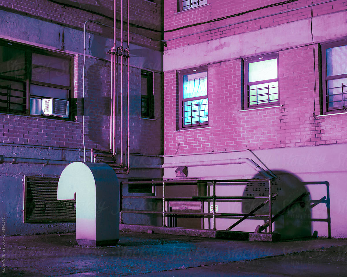 Industrial Pipes outside building at night