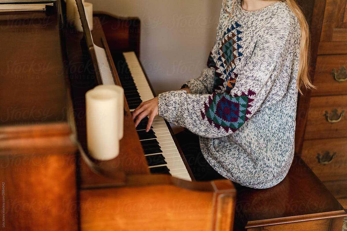 young woman playing piano