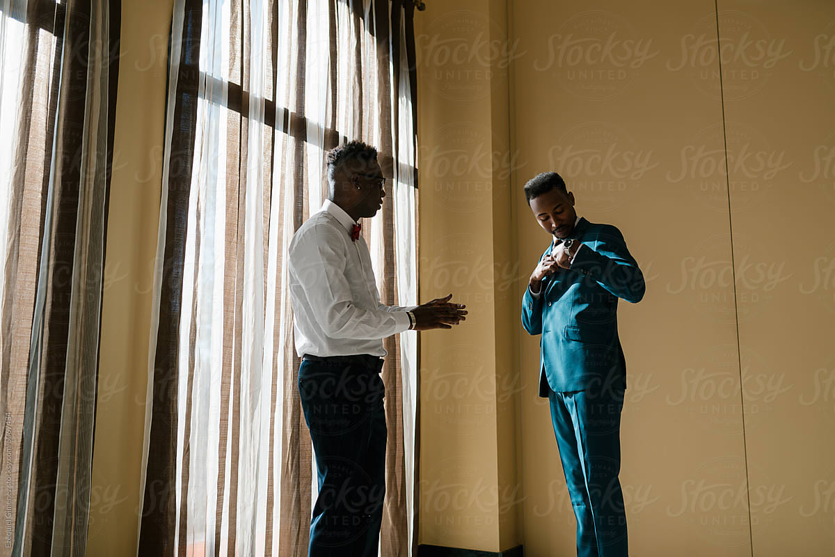 Stylish black men preparing for wedding