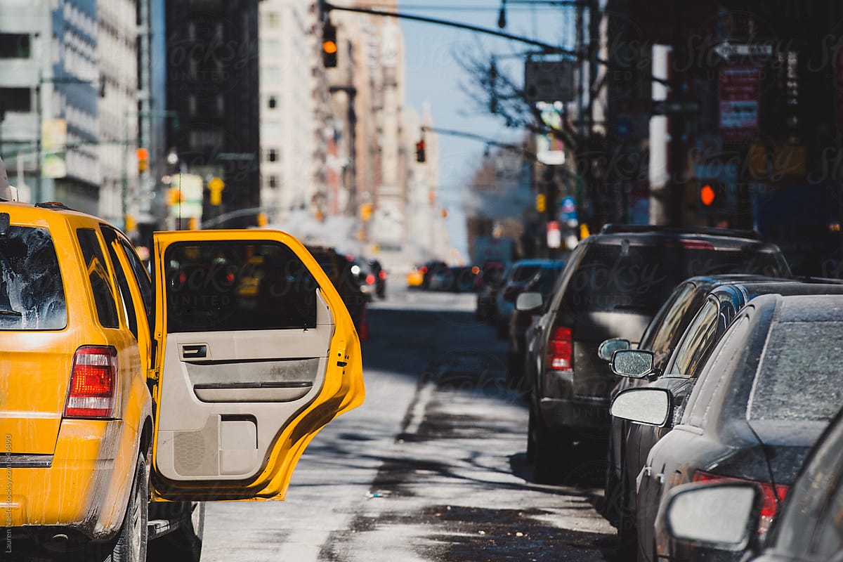 Yellow taxi cab in street