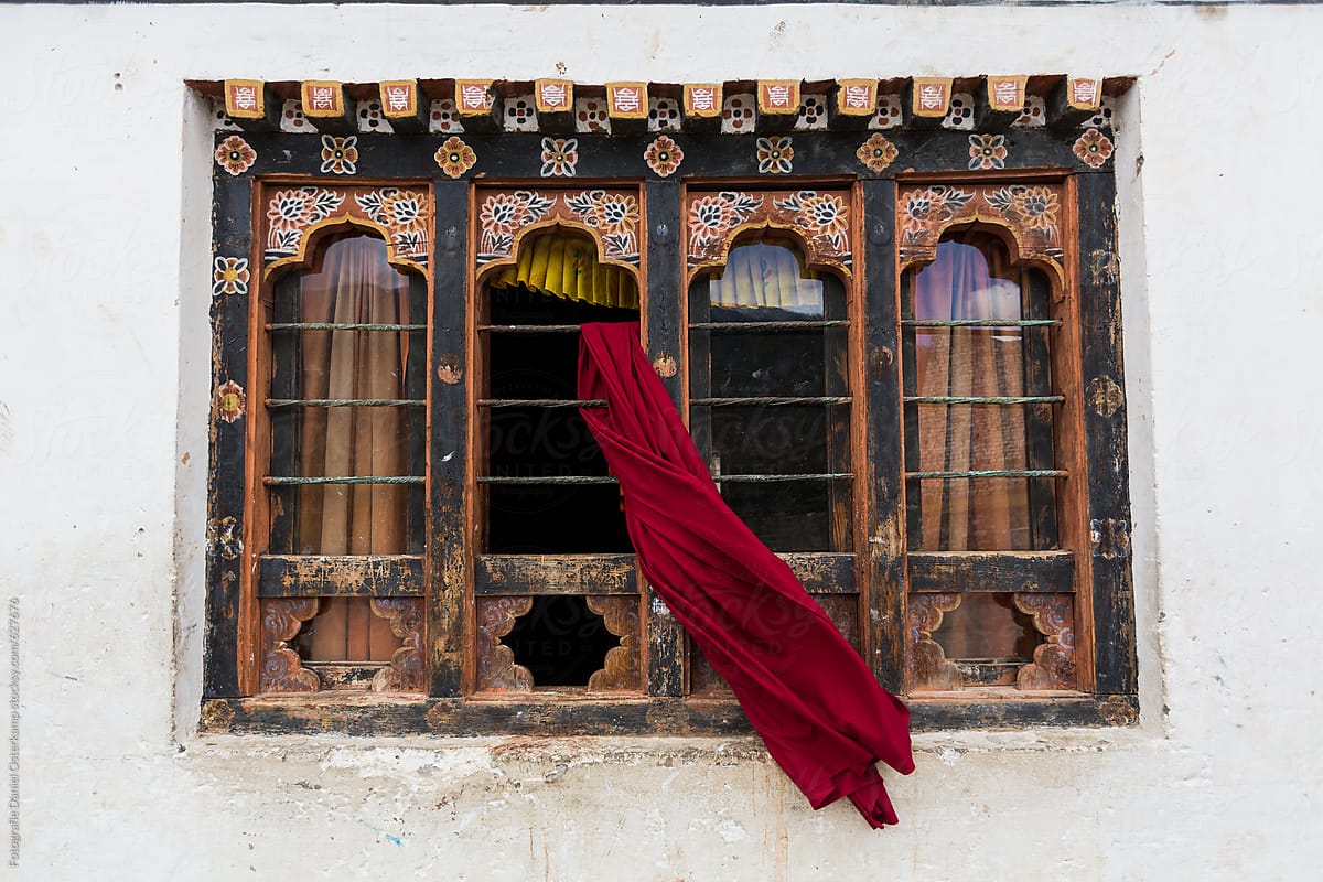Monk robe hanging out of a window in Bhutan