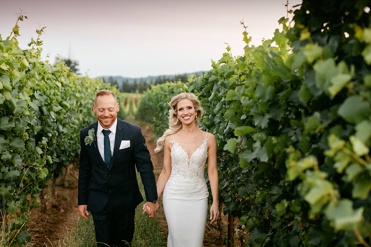Happy Couple Walking together in Vineyard