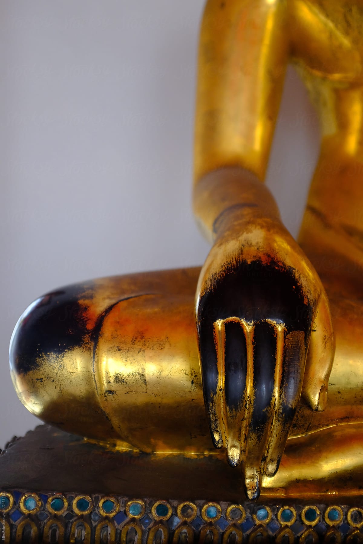 close-up of metal Buddha statue