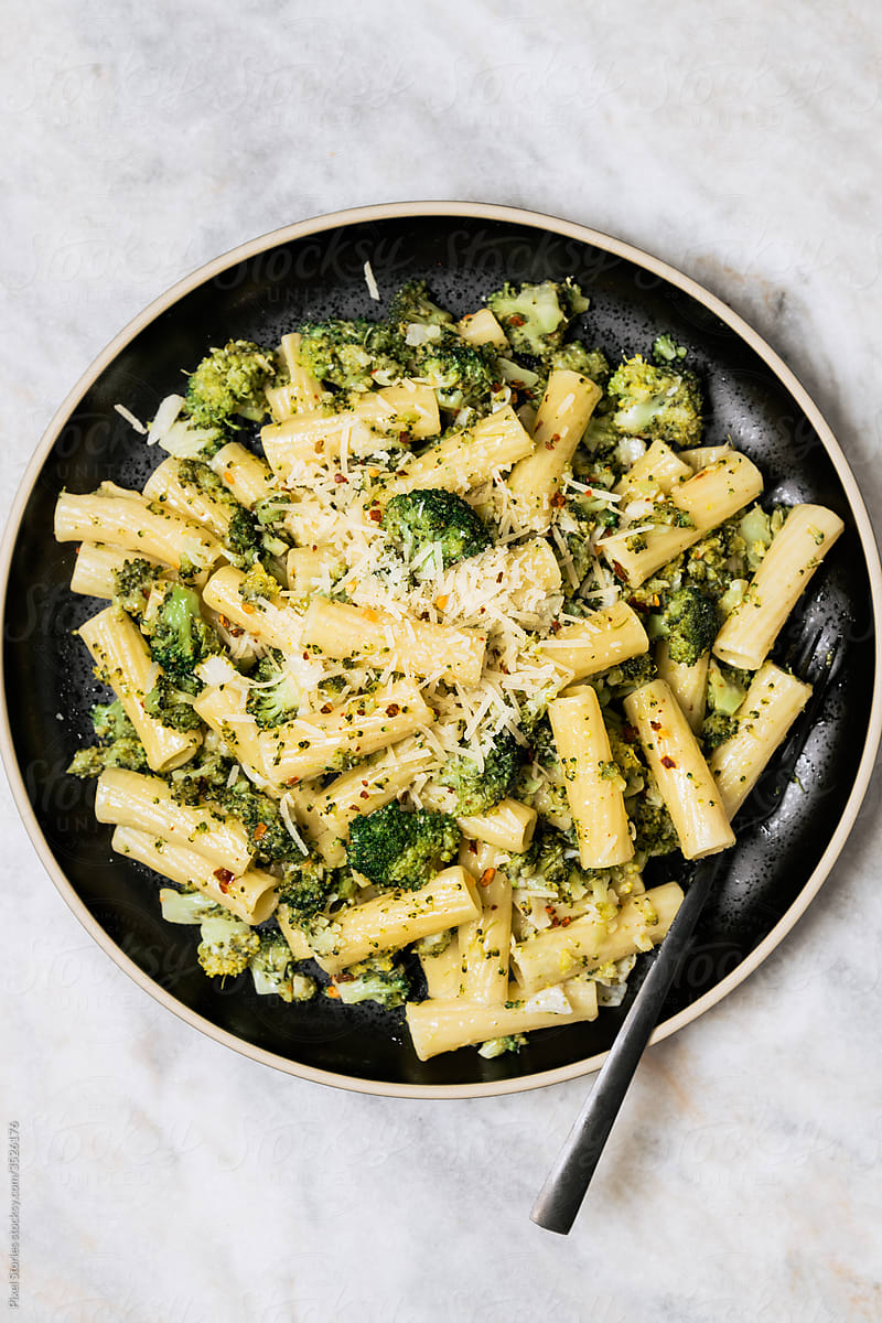 Macaroni pasta with broccoli and Parmesan cheese