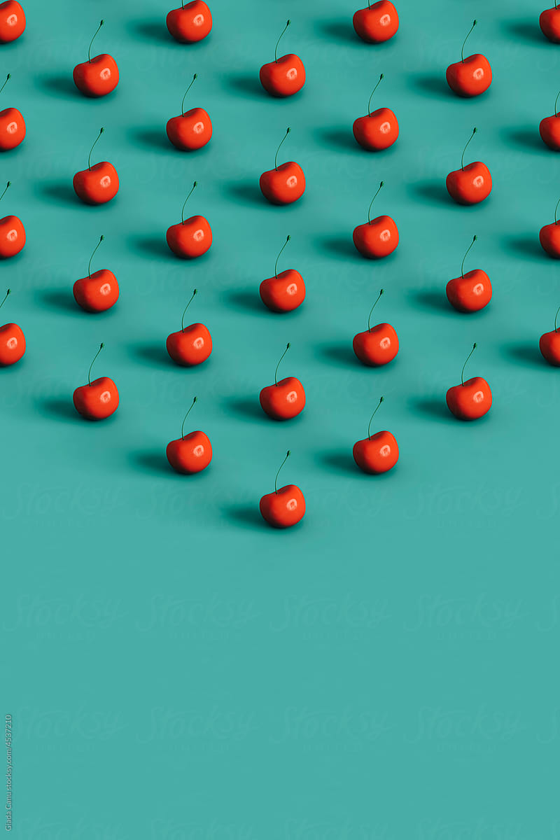 triangles of many red cherries with copy space