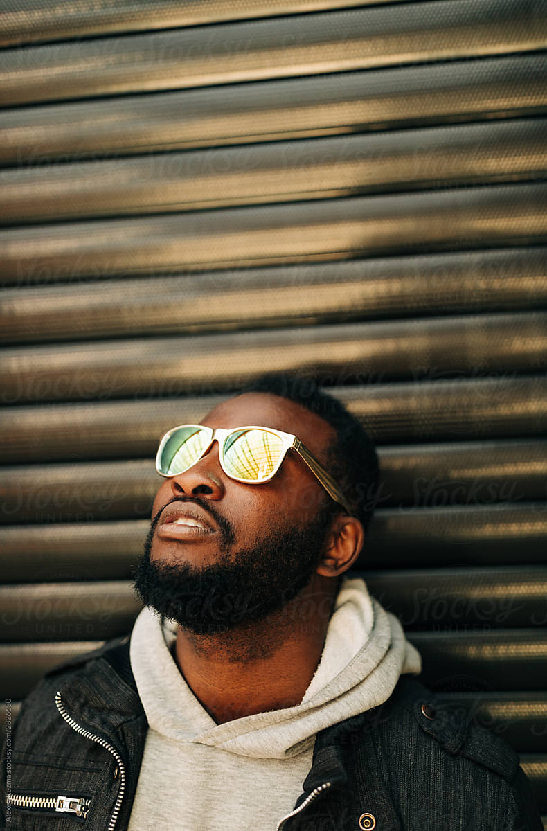 young african american man with golden sunglasses