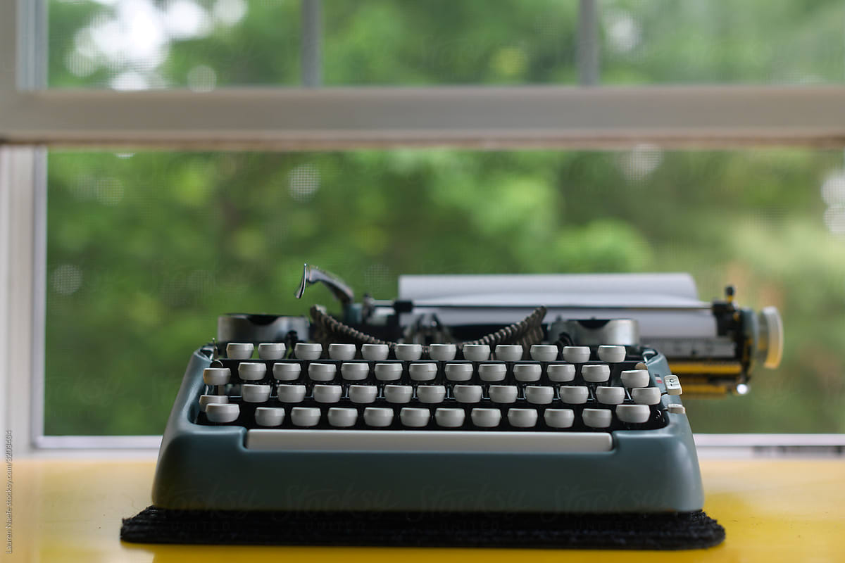 Clean typewriter in front of open window