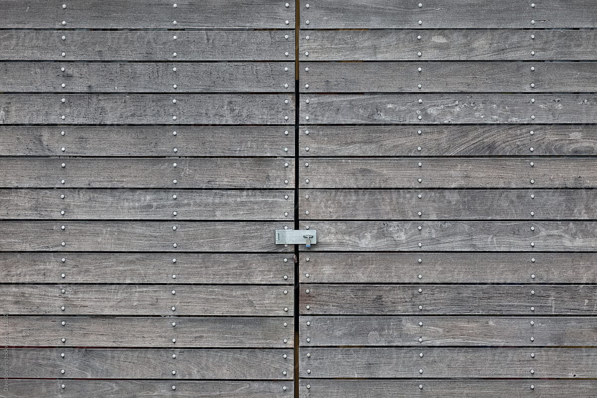 Weathered wood doors with a padlock