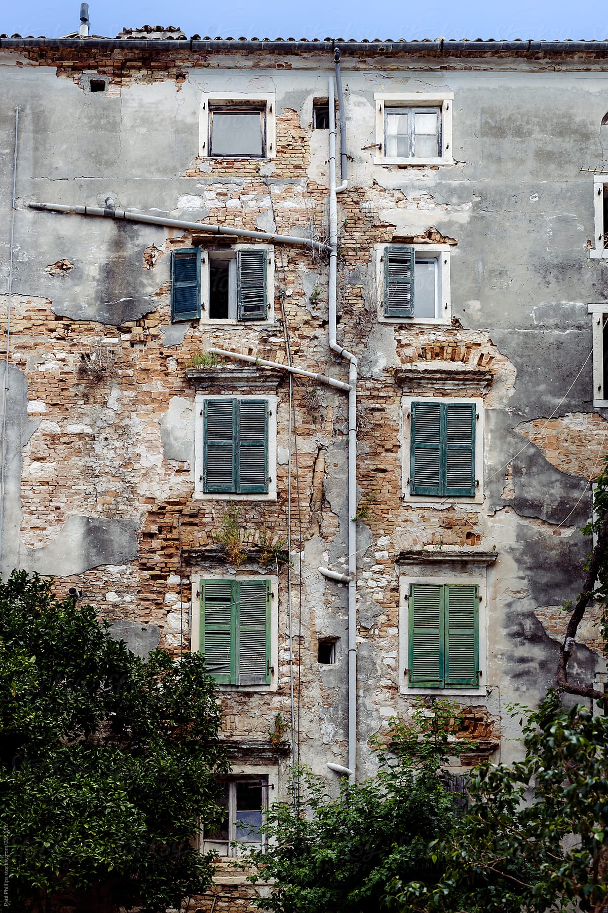Crumbling exterior of an old Venetian style city building
