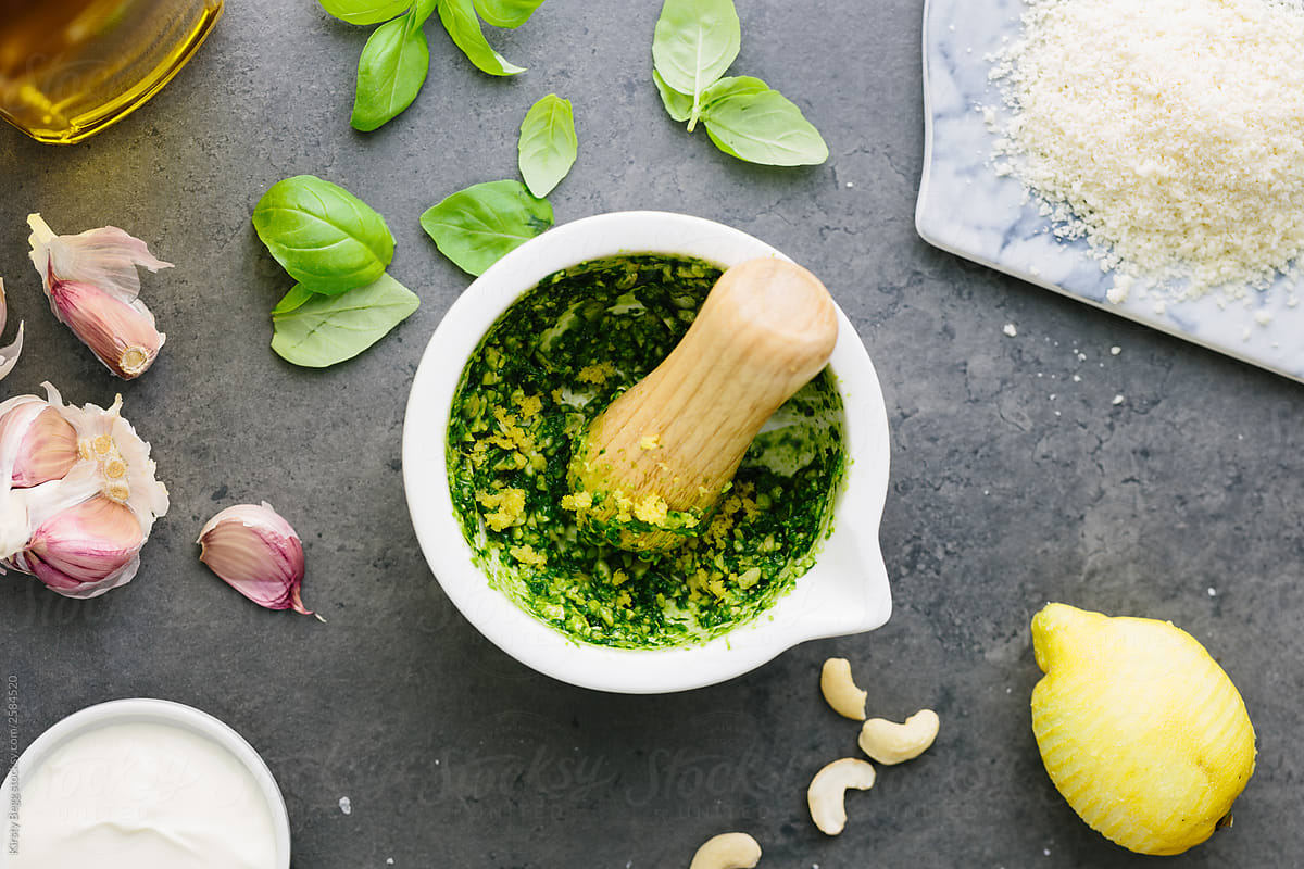 Making pesto in a motar with a pestle