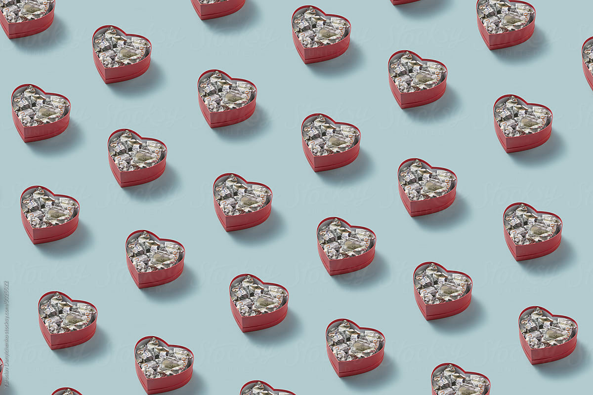 Pattern of dollars inside red heart-shaped boxes.