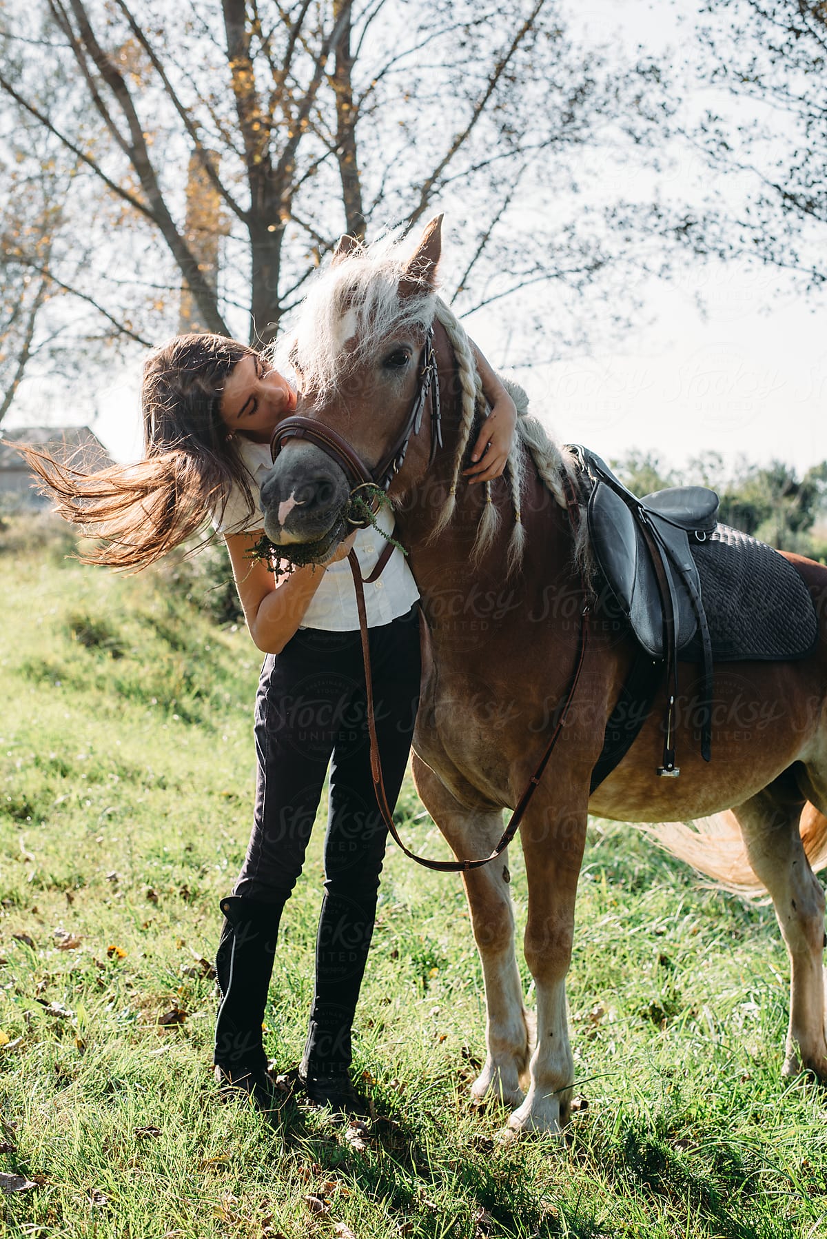 Teenage Girl Giving a Kiss to Her Horse