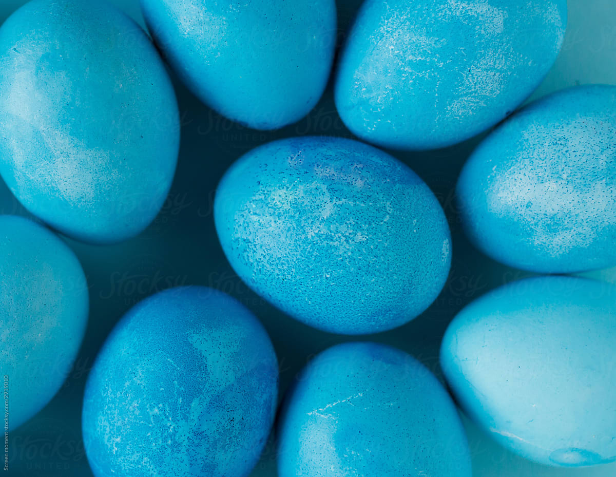 Blue Easter eggs on blue background.