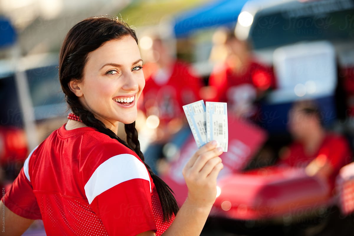 Tailgating: Girl Excited for Football Game with Tickets