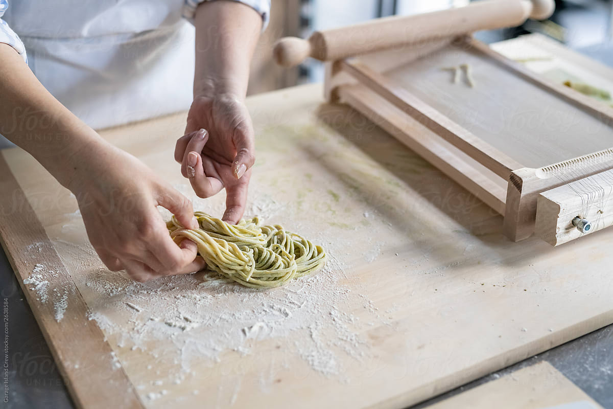 Making pasta during a kitchen lesson