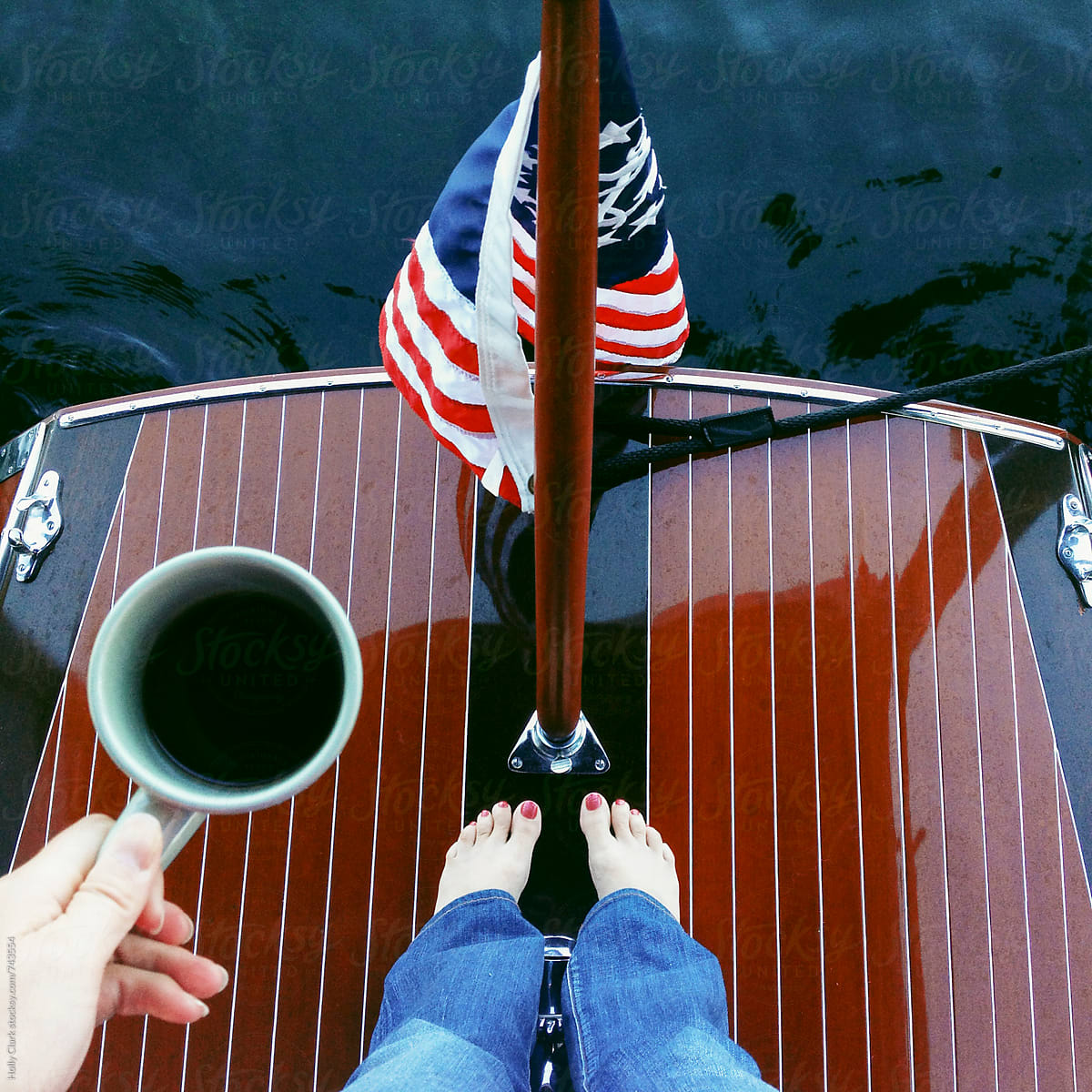 A Women Enjoys Coffee On The Back Of A Wooden Boat By Stocksy Contributor Holly Clark Stocksy