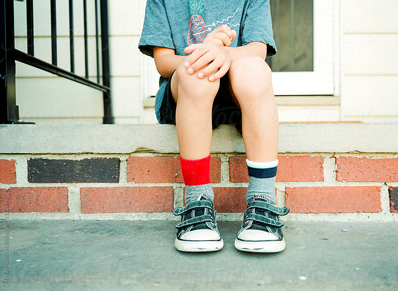 child with mismatched socks