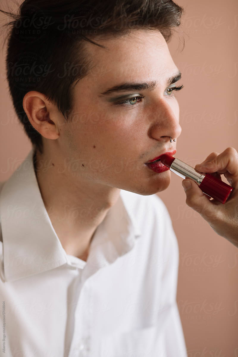 Non-binary Man Having Makeup Applied