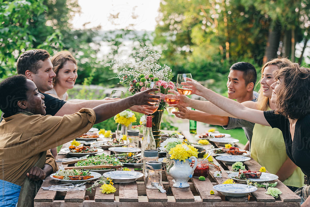 Outdoor Summer Dinner Party - Cheers by Stocksy Contributor Jen Grantham  - Stocksy