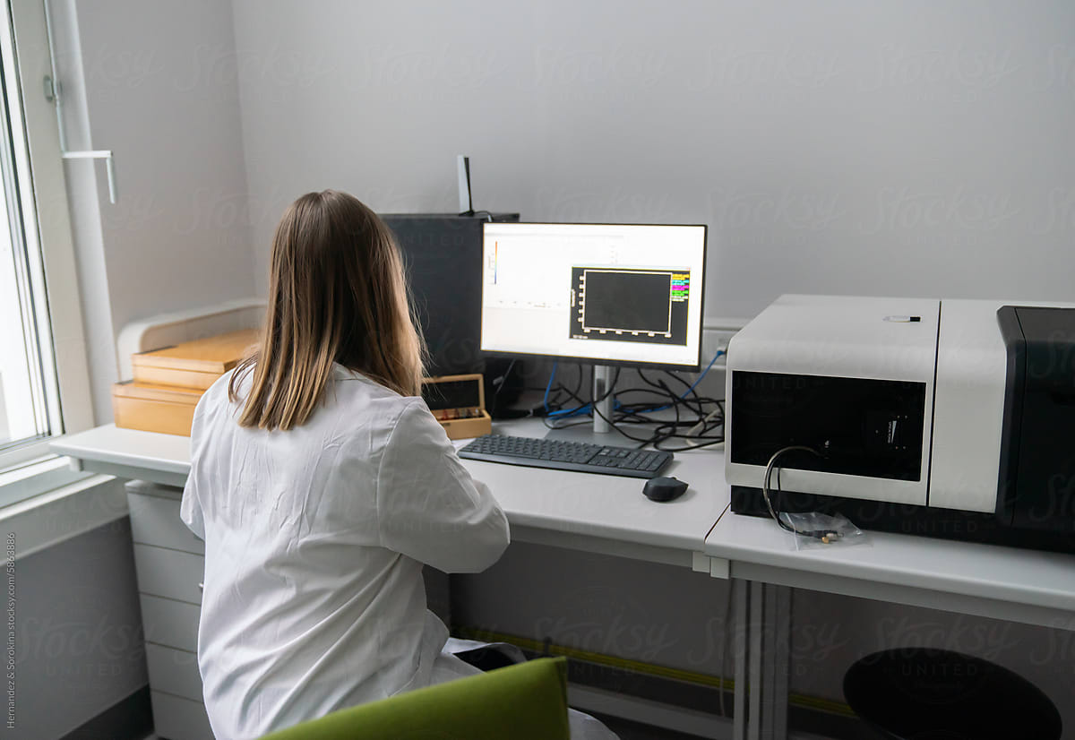 Researcher Working With Spectrofluorometer