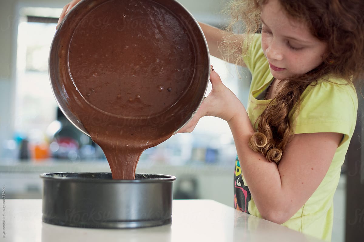 Girl making a chocolate cake.