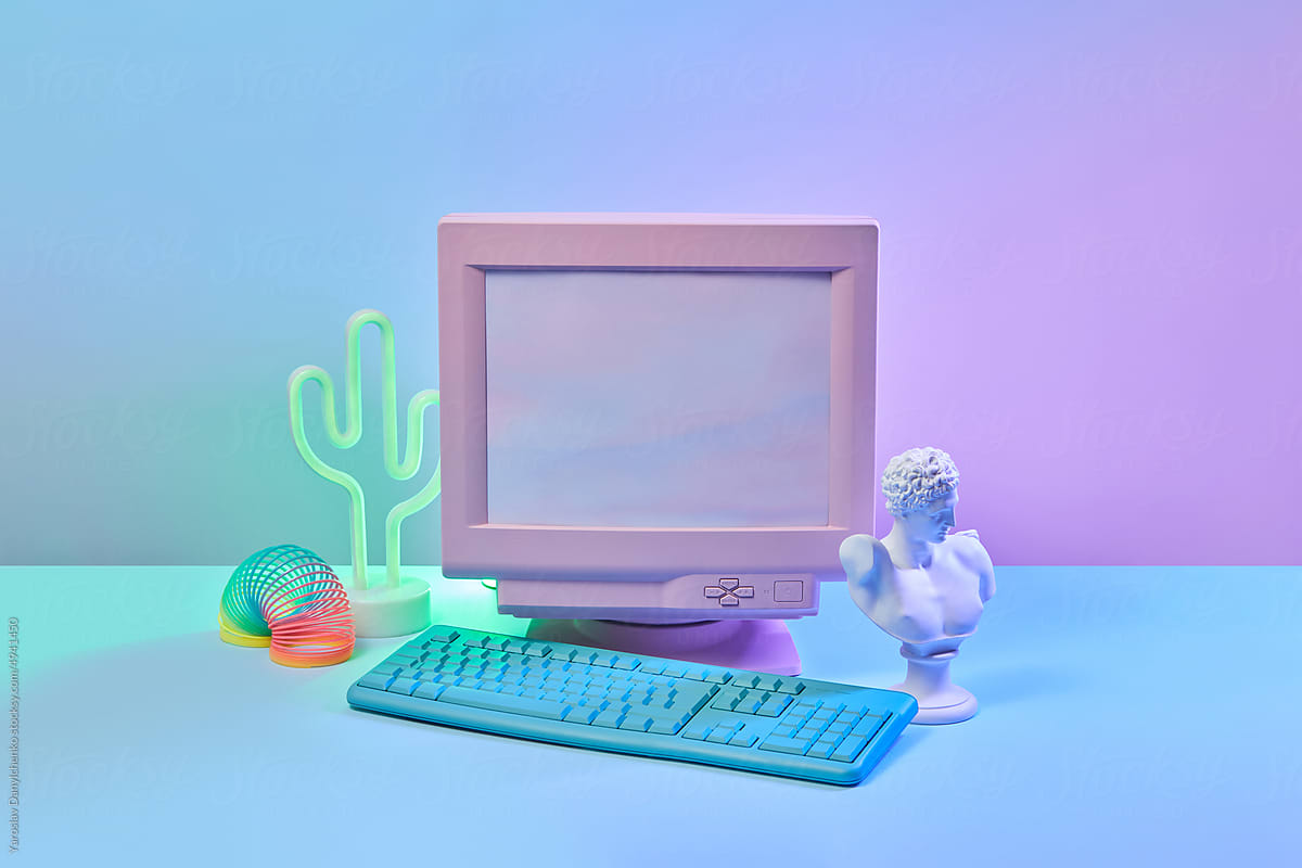 Computer, spring toy, statue and neon lamp.