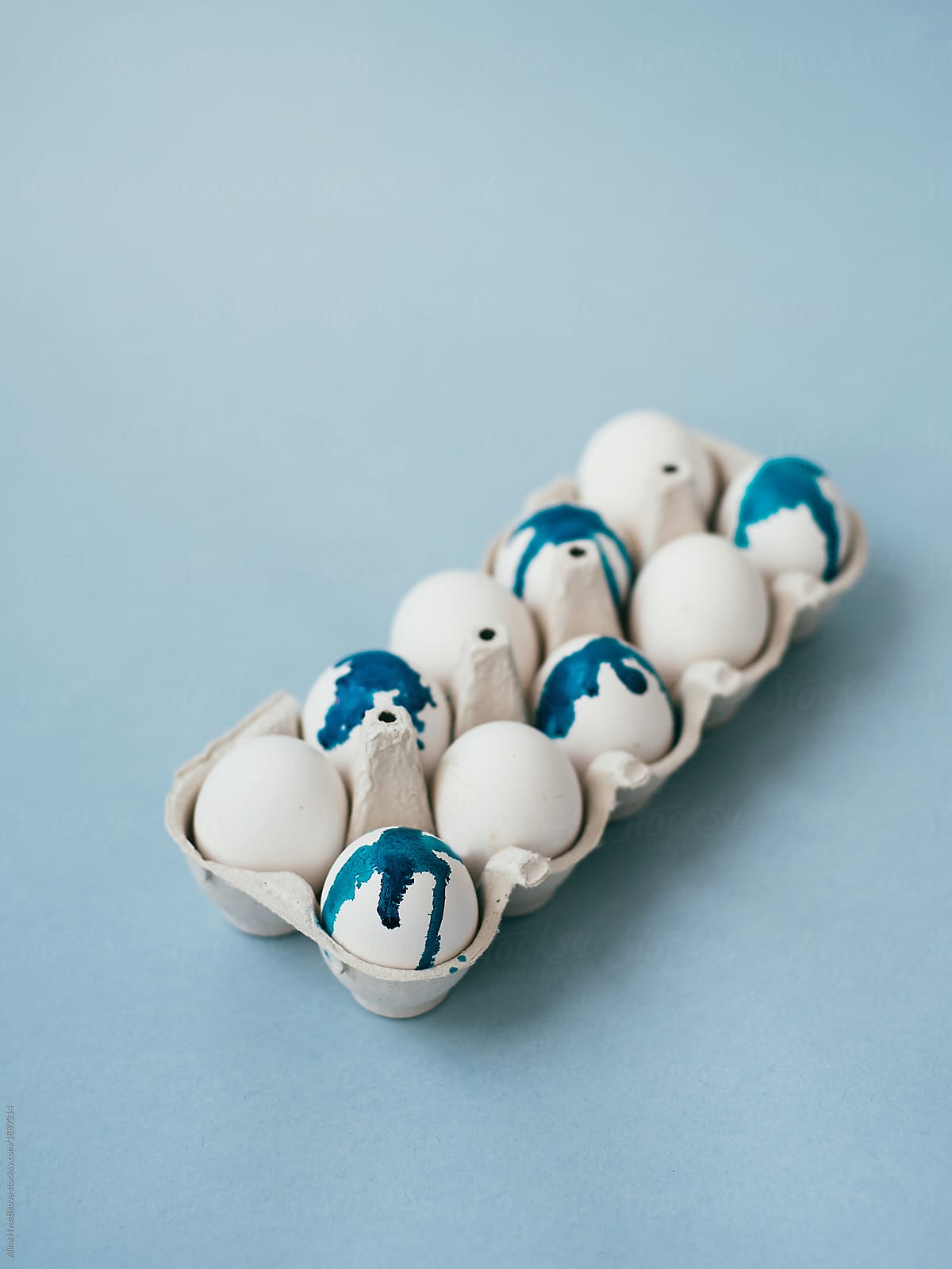 Rack with blue painted eggs