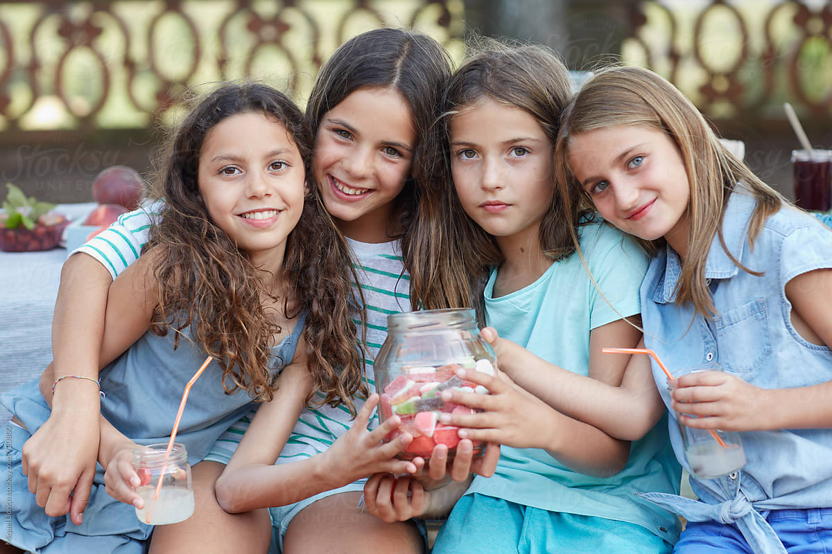 Group portrait of children in a birthday party outdoors