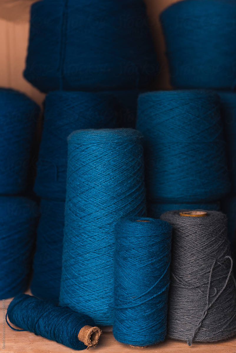 Big rolls of wool in different shades of blue