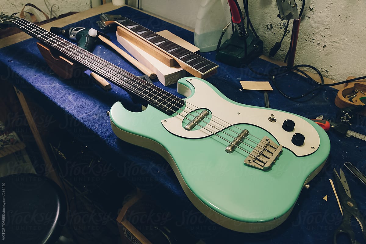 An Electric Bass Being Repaired